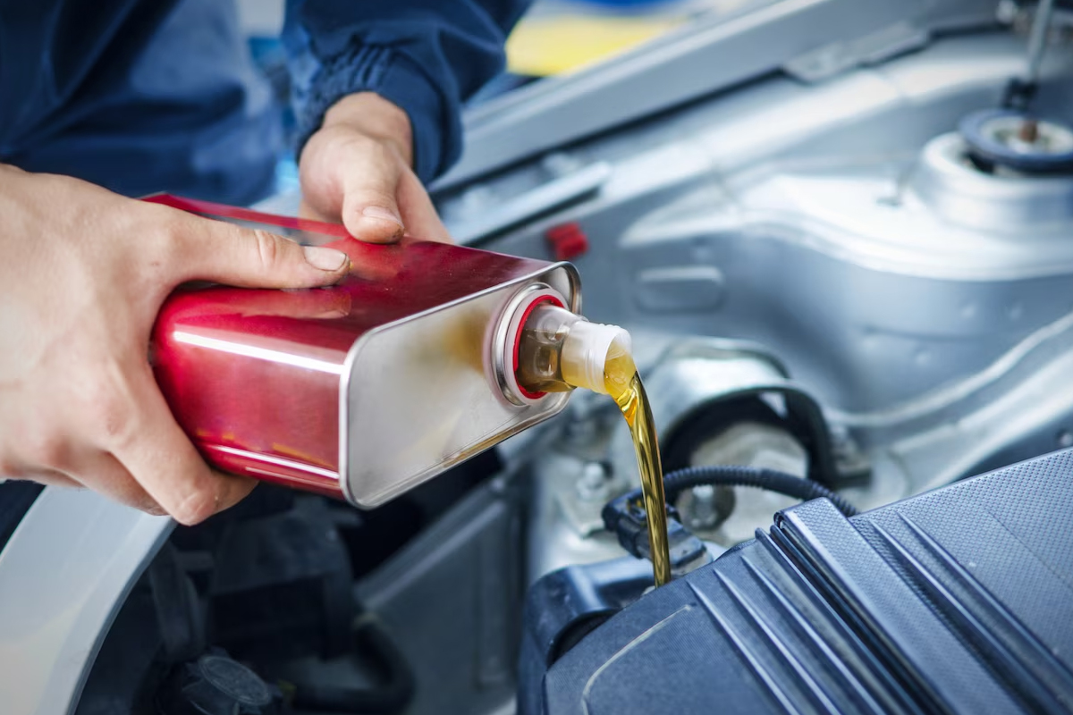 Oil being poured into a vehicle at our dealer near Clifton Park, NY.